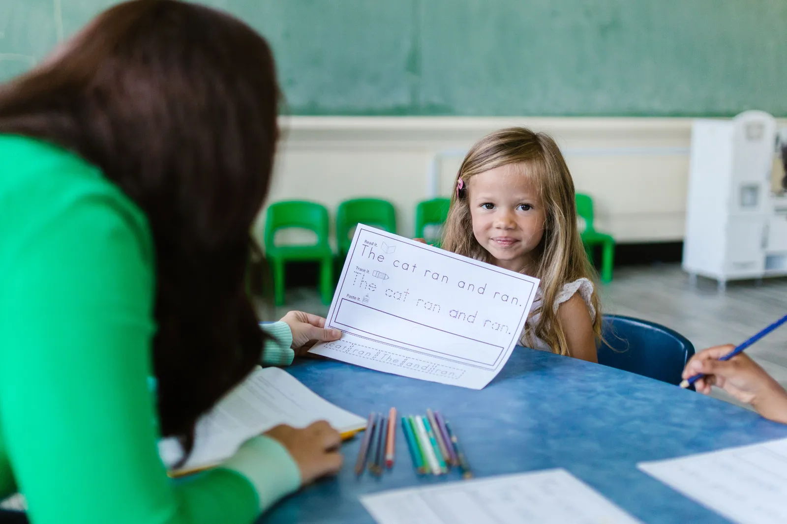 A parent reviewing their child's IEP document